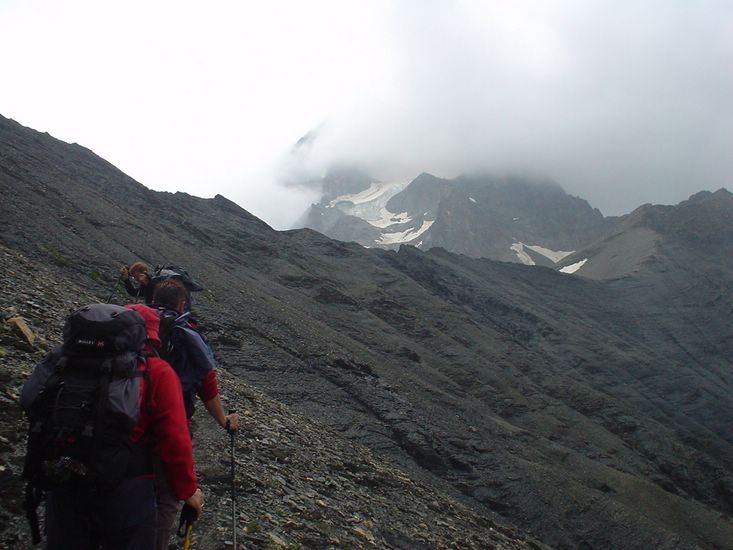 On the way up to the las pass of the day, Col de Vallonpierre, 2607m. The Glacier de Sirac only partially visible because of the weather.