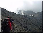 On the way up to the las pass of the day, Col de Vallonpierre, 2607m. The Glacier de Sirac only partially visible because of the weather.